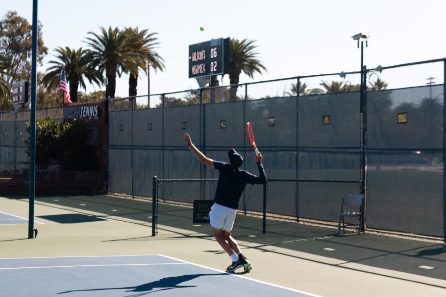 An Arizona mens tennis player serves during the game against New Mexico State on Feb. 6 at Lanelle Robson tennis center. New Mexico State won this set 7 games to 5.