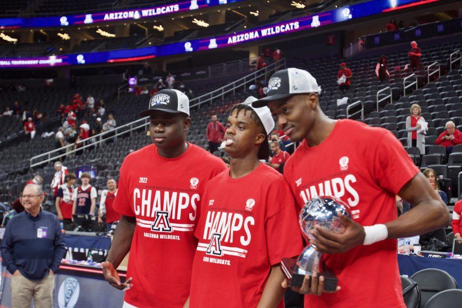 (Left to right) Oumar Ballo, Adama Bal and Christian Koloko celebrate in T-Mobile arena after winning the Pac-12 Tournament Championship on March 12. 