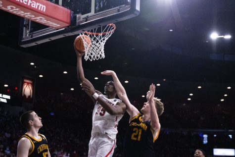 Arizona player, Chrisitan Koloko (35), goes up against a Cal player to score in McKale Center on March 5. Koloko finished with 8 total points helping the Wildcats win 89-61. 