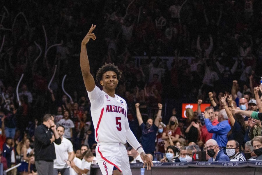 Arizona player, Justin Kier (5), celebrates making a three point shot in McKale Center on March 3. Kier made two three pointers in the win against Stanford.