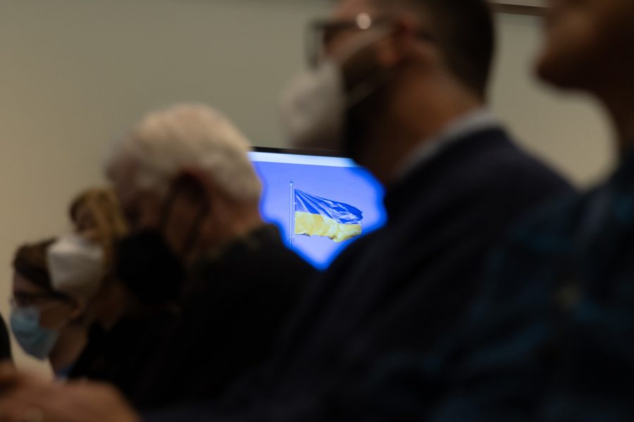 An image of a flag on a TV is shown between audience members of the peace rally in Old Main on March 29. The event hosted by the Department of Russian and Slavic Studies was held as a way to protest the war in Ukraine.