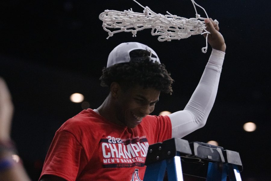 Arizona player, Justin Kier, swings the net around after cutting it down to commemorate the Wildcats PAC-12 regular-season title. Arizona will play in the PAC-12 tournament in Las Vegas next.