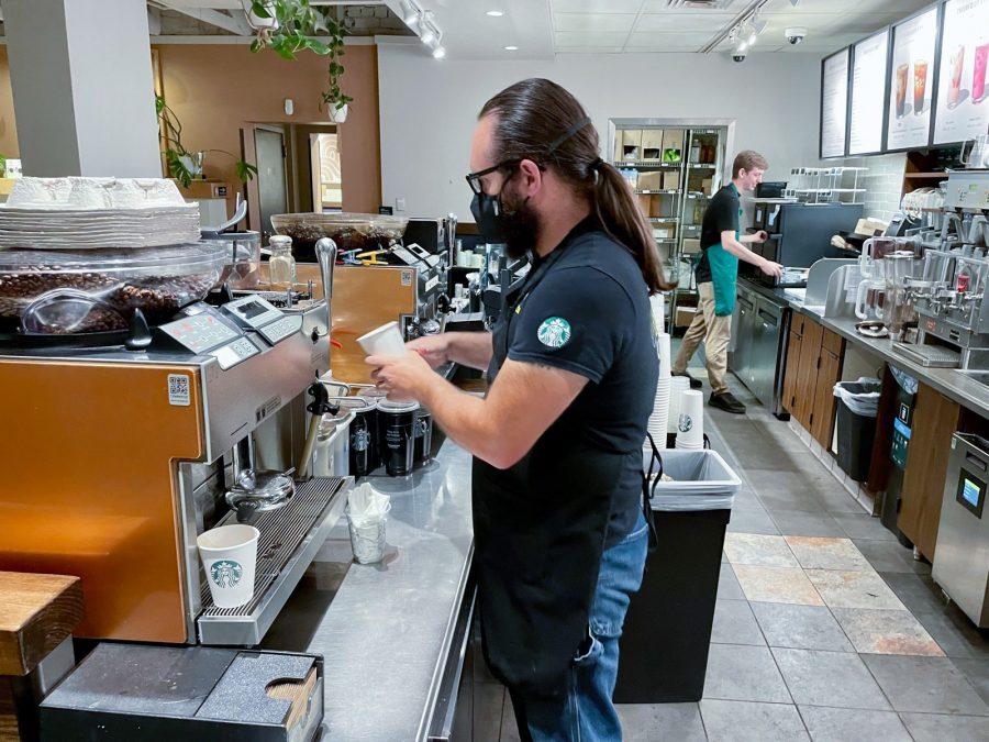 Starbucks barista James Pack whips up a latte on Sunday, April 24 in the Starbucks on University Boulevard. Workers at the Starbucks on University and Euclid Avenue voted to unionize on July 6, 2022.