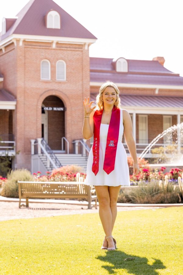 Aubrey Thrower in front of Old Main. (Courtesy Chris Richards)