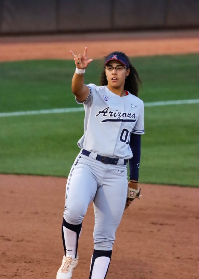 Sophia Carroll an infielder on the Arizona softball team shows two outs to her pitcher on March 12 in Rita Hillenbrand Memorial Stadium. The Wildcats would go on to win 10-6.