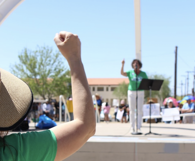 A woman in the crowd raises a fist in solidarity with Betsy Boggia, who speaks at the rally for legal abortion on May 14, 2022, in Armory Park in Tucson, Arizona. Protests like these will likely become much more common following Fridays Roe v. Wade overruling. 