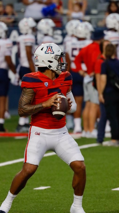 Jayden De Laura, a quarterback on the Arizona football team, throws passes during a seven-on-seven drill before a scrimmage on Saturday, Aug. 20 at Arizona Stadium. The mock game would consist of the offense taking on the defense for the night in a friendly scrimmage.