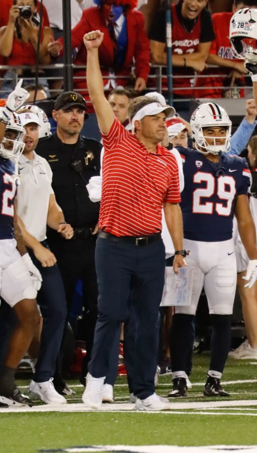 Arizona football coach Jedd Fisch raises his fist in the air in the last seconds of a football game against North Dakota State University on Saturday Sept. 17 in Arizona Stadium. The Wildcats won the game 31-28 advancing their record to 2 and 1. 