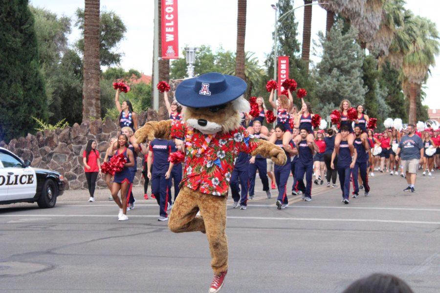 Wilbur the mascot dances down University Boulevard at the start of Bear Down Friday parade on Sept. 9. Wilbur and Wilma are the ones to lead the rest of the parade to the stage.