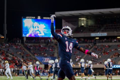DJ Warnell Jr., a safety on the Arizona football team, hypes up the crowd at the game against the University of Colorado Boulder on Saturday, Oct. 1, at Arizona Stadium. The Wildcats would go on to win the game 43-20 and advance their record to 3-2.