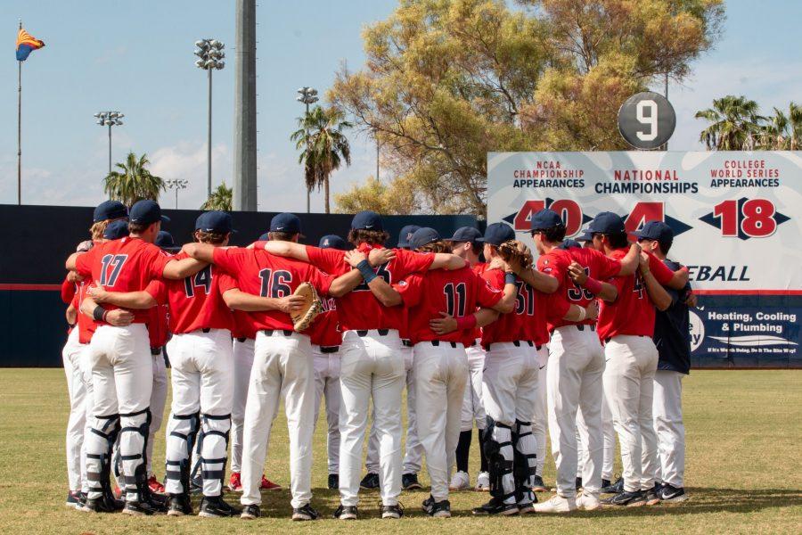 The Arizona baseball team huddles before a scrimmage against Pima Community College on Oct. 15 at Hi Corbett Field. The Wildcats would go on to win the game 5-0.