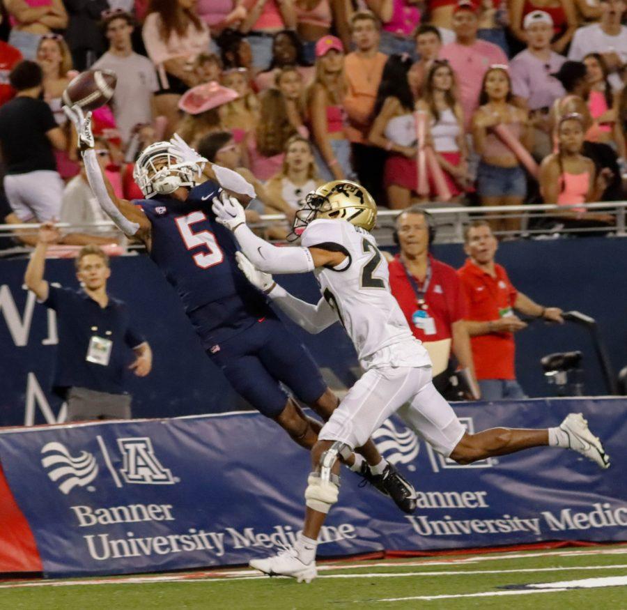 Dorian Singer, a wide receiver on the Arizona football team, makes a diving catch in a game against Pac-12 opponent the University of Colorado Boulder on Oct. 1 at Arizona stadium. The Wildcats would win the game 43-20. 