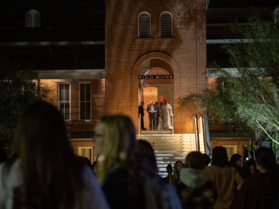 University+of+Arizona+President+Dr.+Robert+C.+Robbins+and+Father+Emmanuel+Taylor+walking+out+to+give+a+speech+at+the+candlelight+vigil+honoring+the+life+of+Thomas+Meixner+on+Oct.+7.+The+speech+took+place+at+Old+Main+on+the+University+of+Arizona+Campus+on+the+UA+Mall.