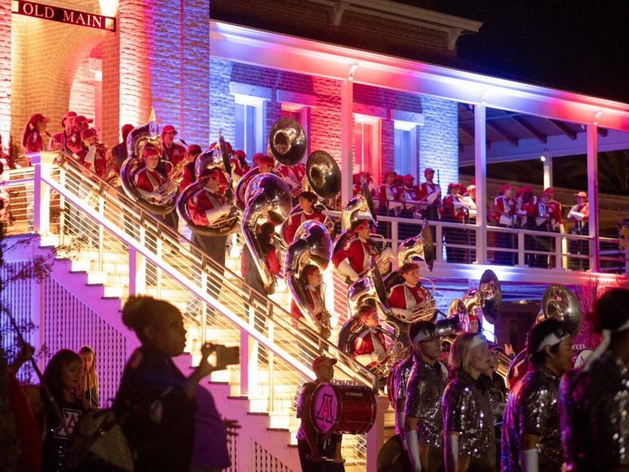The Pride of Arizona marching band plays on Old Main at the Homecoming bonfire and royalty crowning on Oct. 28. Members of the university community, especially students and alumni, were in attendance, and the Tucson Fire Department was on standby monitoring the fire.
