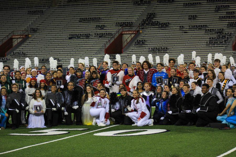 The 2A, 3A and 4A high school marching band drum majors pose with the Pride of Arizona drum majors after the 69th annual Band Day on Saturday, Oct. 15. In the 4A division, Rincon University High School placed first with a score of 78.6.  