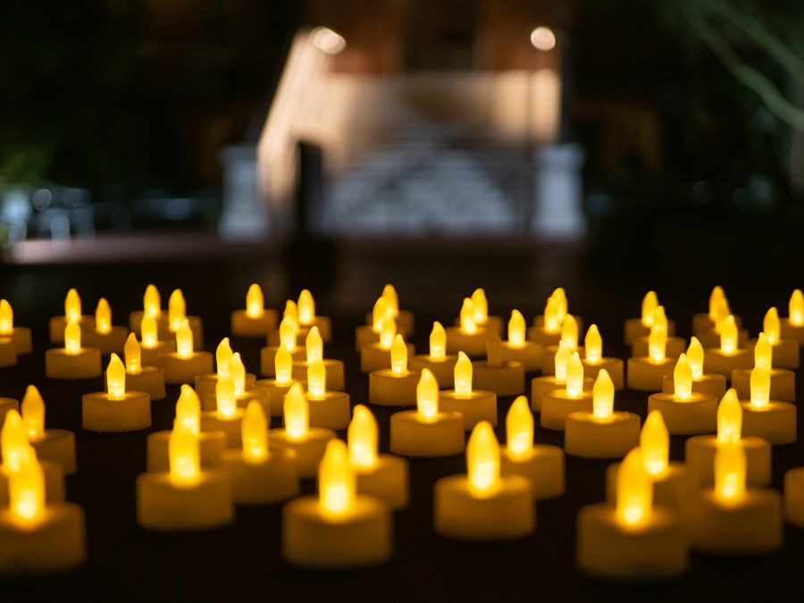 Candles laid out for people to grab before the candlelight vigil honoring the life of Thomas Meixner on Oct. 7. The vigil took place at Old Main on the University of Arizona Campus.