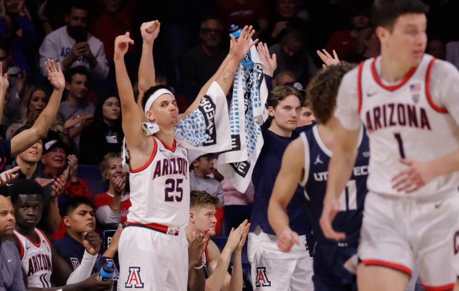 Kerr+Kriisa%2C+a+guard+on+the+Arizona+mens+basketball+team%2C+celebrates+after+a+teammate+scores+in+a+game+on+Nov.+17%2C+in+McKale+Center.+The+Wildcats+won+their+third+game+against+Utah+Tech+Univeristy+104-77.