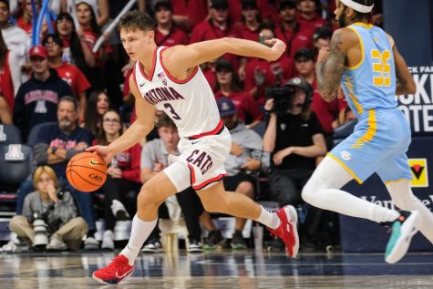 Pelle Larsson (3), a guard on the Arizona mens basketball team, dribbles the ball down the court on Nov. 11, in McKale Center. The Wildcats would the game against Southern University 95-78.