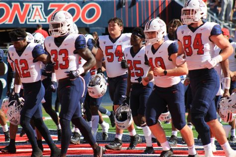 The Arizona football team runs off the field at halftime during their match against Washington State on Nov. 19 at Arizona Stadium. The Wildcats would go on to lose the game 20-31.