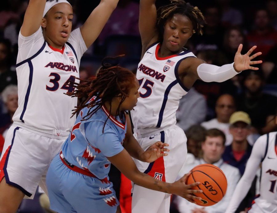 Kailyn+Gilbert+and+Maya+Nnaji+of+the+Arizona+womens+basketball+team+double+team+an+opponent+on+Nov.+18%2C+in+McKale+Center.+The+Wildcats+would+win+the+game+against+Loyola+Marymount+University+87-51.