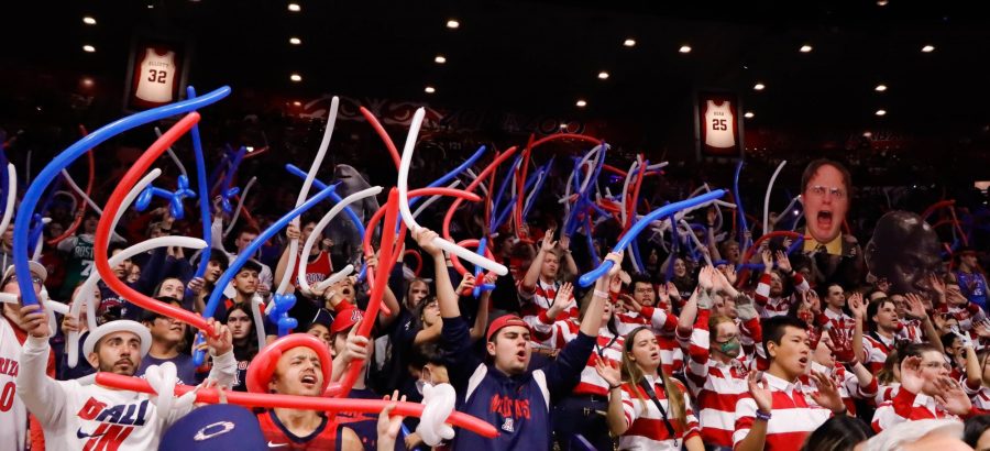 The Zona Zoo section at the Arizona men's basketball team cheers and waves ballon&#8217;s around while the opposing team tries a free throw on Nov. 17, in McKale Center. The Wildcats would win their third game 104-77.