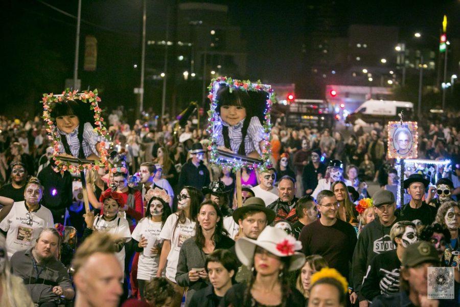 A crowd walked through the streets of the All Souls Procession Ceremony on Nov. 3, 2019. The Ceremony begins when the groups of people arrive at the Finale site. (Courtesy of All-Souls Procession, Photo by Kathleen Dreier)