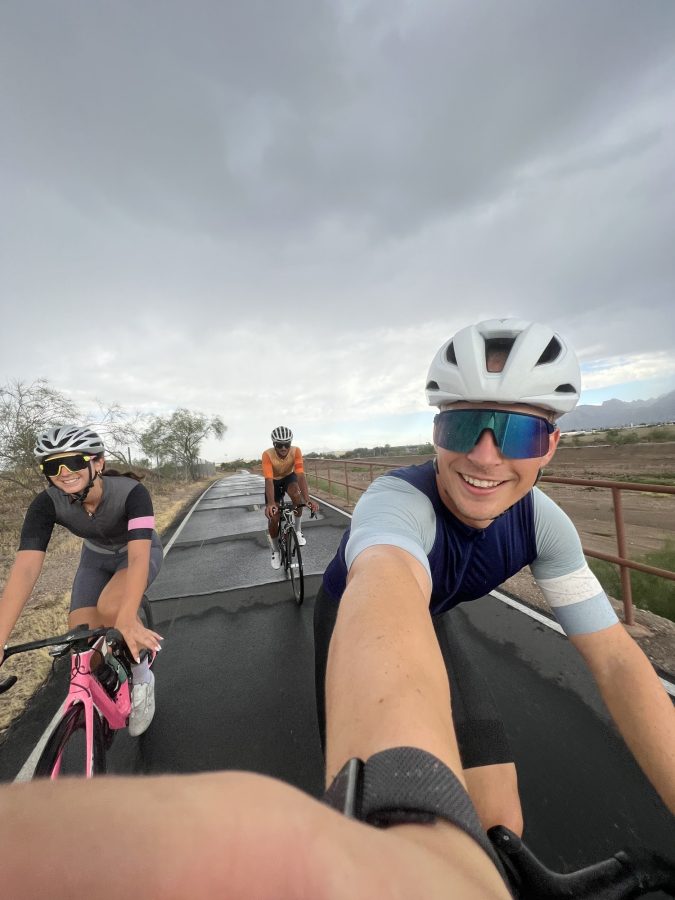 Blake Jankowski (right) and friends biking The Loop in the rain. Credit to Blake Jankowski. 