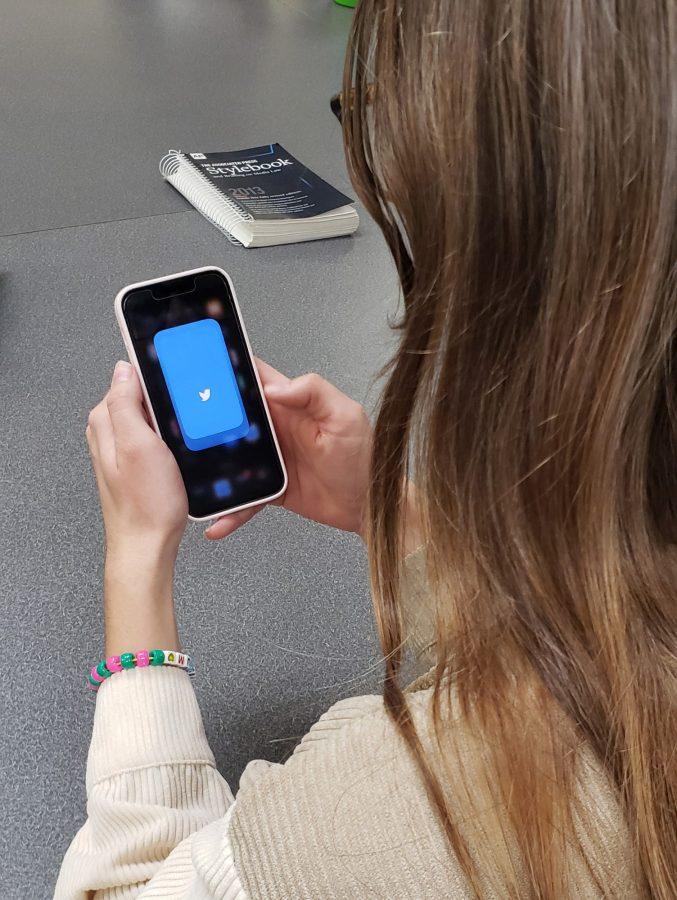 A student checks Twitter on their phone on Nov. 17 at the University of Arizona. 