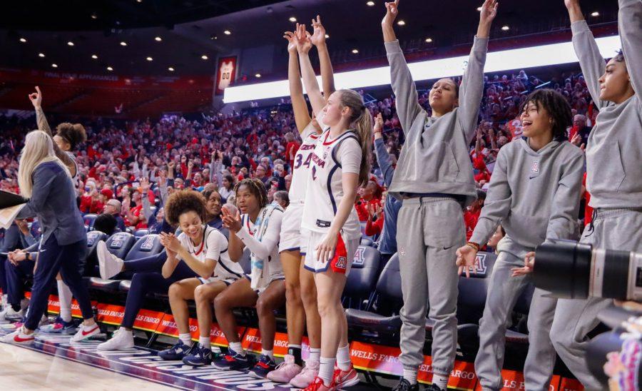The Arizona womens basketball bench celebrates a 3-point shot on Jan. 27, in McKale Center. The Wildcats won the game 61-54.