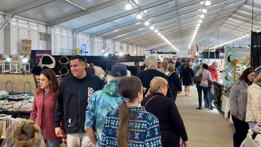Visitors of the 22nd Street Mineral, Fossil & Gem Show walk through a venue tent on Jan. 29. Tucson is experiencing a rebound in its tourism as of late resulting in crowds such as these. 