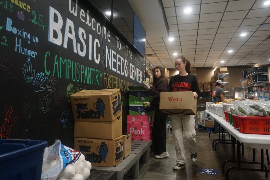 Campus+Pantry+volunteers+organize+food+into+different+baskets+in+the+Sonora+Room+on+the+first+floor+of+the+Student+Union+Memorial+Center+on+Friday%2C+Feb.+24.+The+goal+of+the+pantry+is+to+reduce+food+insecurity+in+the+University+of+Arizona+community+by+offering+free+food+staples+to+students+and+staff.