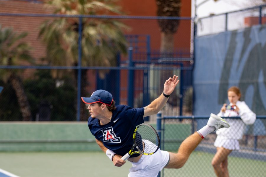 Colton Smith lunges in a doubles match against Pepperdine University on Feb. 3 at the LaNelle Robson Tennis Center. The Wildcats went on to win the match 6-1. 