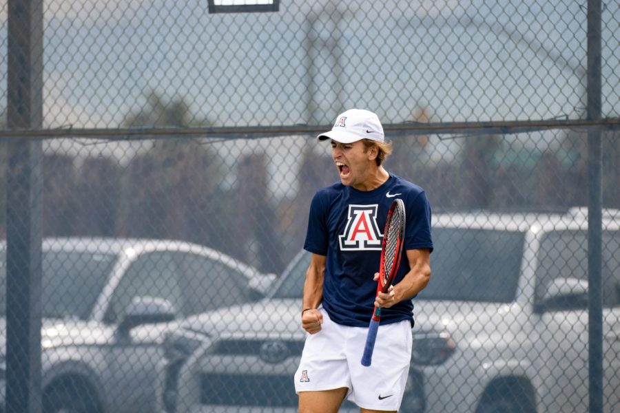 Gustaf Strom a player on the Arizona mens tennis team screams in celebration after winning a point in a game against Pepperdine University on Feb. 3 at the LaNelle Robson Tennis Center. The Wildcats went on to win the match 6-1.