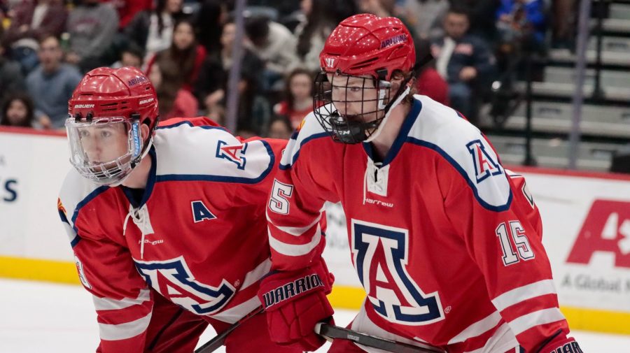 Arizona hockey players get set before a face-off in a game agiant rival ASU on Feb. 24, 2023 in the Tucson Conversation Center. The Wildcat hockey team won 1-0.
