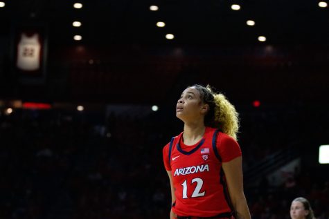 University of Arizonas Esmery Martinez finishes an attempted shot in the game against Stanford University on Feb. 9 in McKale Center. The Wildcats went on to lose the game 84-60. 