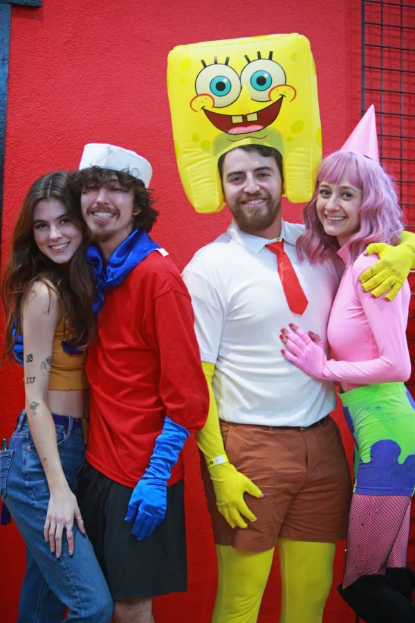 Two couples pose in their SpongeBob SquarePants costumes for the Bikini Bottom Rave at The Rialto Theatre on Friday, Feb. 17. Many people dressed as SpongeBob or Patrick, as well as other characters from the TV show. 