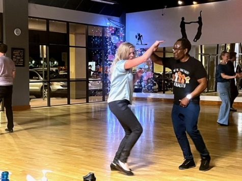 Zo Carroll, president of the Tucson Swing Dance Club, dances with his partner in the groups studio on Feb. 16. (Photo by Joseph Flores, El Inde Arizona)