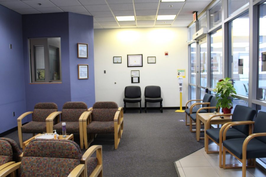 Chairs stretch down the waiting area inside the Counseling and Psych Services office. CAPS offices are located on the third floor of the Campus Health Center. 