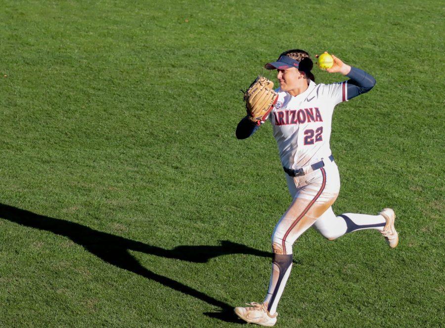Arizona+softball+outfielder+Paige+Dimler+fields+a+ball+in+the+outfield+and+throws+a+base+runner+out+at+first+in+a+game+against+Weber+State+University+on+March+3+at+Mike+Candrea+Field+at+Rita+Hillenbrand+Memorial+Stadium.+Arizona+beat+Weber+State+8-0.