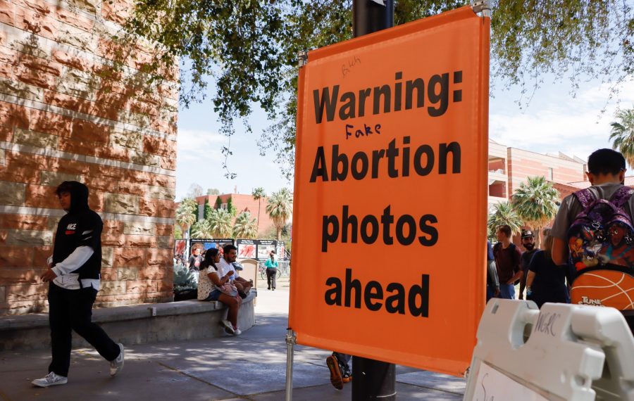 A sign next to the University of Arizonas Student Union Memorial Center warns passersby of the display set up on campus put on by an anti-abortion group called the Center for Bio-Ethical Reform from Wednesday, April 12, to Thursday, April 13. The display included large, graphic images, including photos of dead people who died in the Holocaust or from lynching, which sparked outrage from many students and community members.