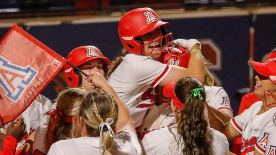 Allie+Skaggs%2C+second+baseman+of+the+Arizona+softball+team%2C+starts+to+get+lifted+into+the+air+after+a+walk-off+grand+slam+to+end+a+play-in+game+against+Pac-12+rival+ASU.+Arizona+won+the+game+13-4+in+five+innings+run-ruling+ASU+during+the+first+ever+Pac-12+softball+tournament.+