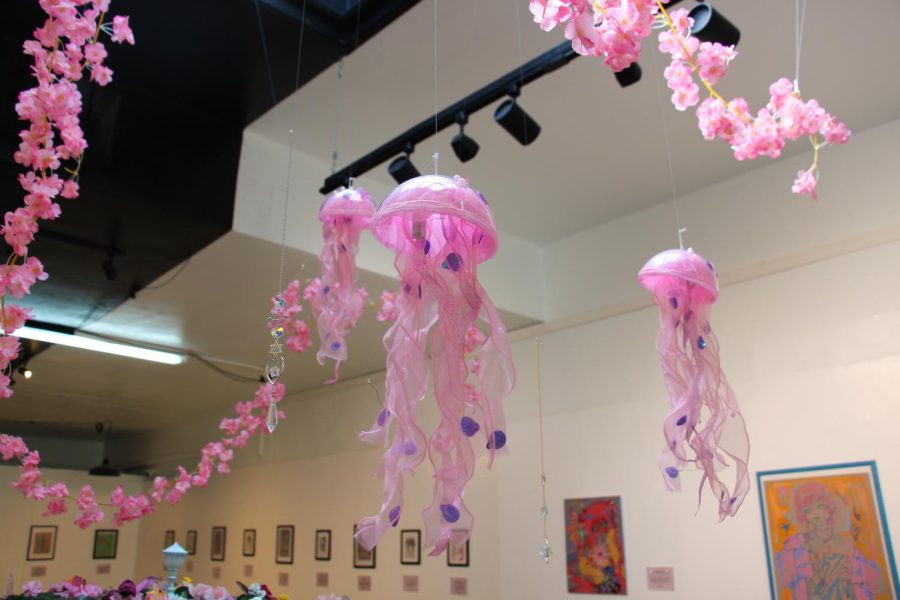 Hanging jellyfish art pieces adorn Bethzaira Lopezs solo &gallery exhibition Darlings. Cynthia Naugle, the owner of &gallery, encourages local artists to have solo exhibitions to be personal with their creations and self-expression. 