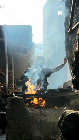 A man cooks food at a popular local restaurant, Ali Madra, in Baab Al-Kabir, the oldest area of the city of Taiz, Yemen on Feb. 16, 2023. The wood-fired food consists of beans with garlic and spices, along with a type of bread called khameer. It is prepared in a traditional Yemeni way that gives it a delicious taste and unique smell. 