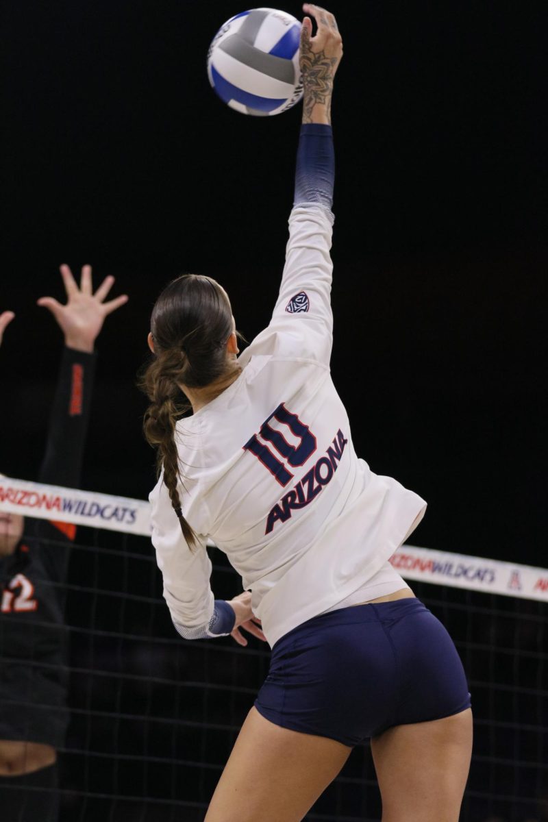 Puk Stubbe spikes the ball to Pacific in their home matchup at McKale Center on Aug. 26, 2023.