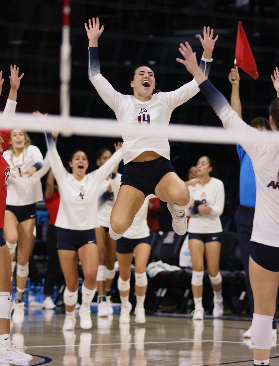 Ava Tortorello leads the team in celebrating the first win of the season over Pacific on Aug. 26, 2023 at McKale Center.