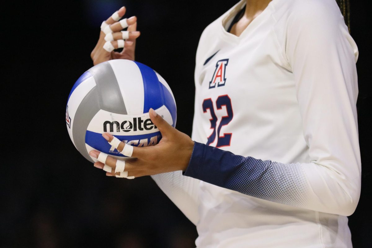 Alyna Johnson prepares to serve in the first win of the season for UA Volleyball against Pacific on Aug. 26, 2023 at McKale Center.