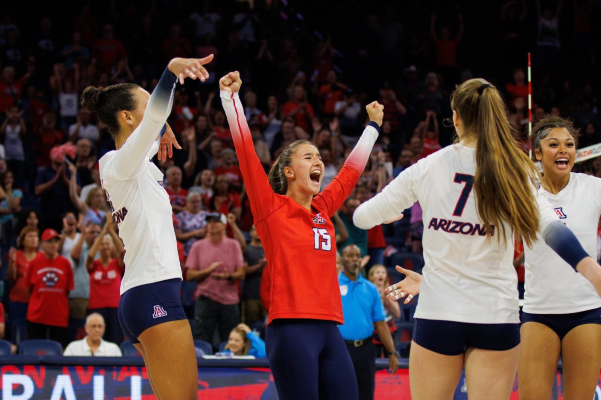 Giorgia Mandotti (15) celebrates a point with her teammates in a game against New Mexico State on Friday, Sept. 15 at McKale Center. The Wildcats won the game 3-1.