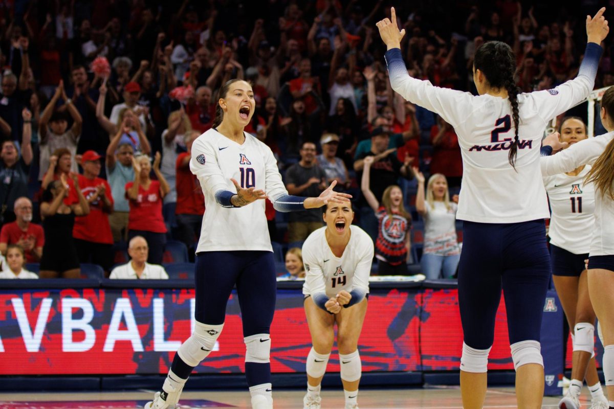 Puk Stubbe (10) celebrates with her team after a win against New Mexico State on Friday, Sept. 15, in McKale Center. The Wildcats won the game 3-1.
