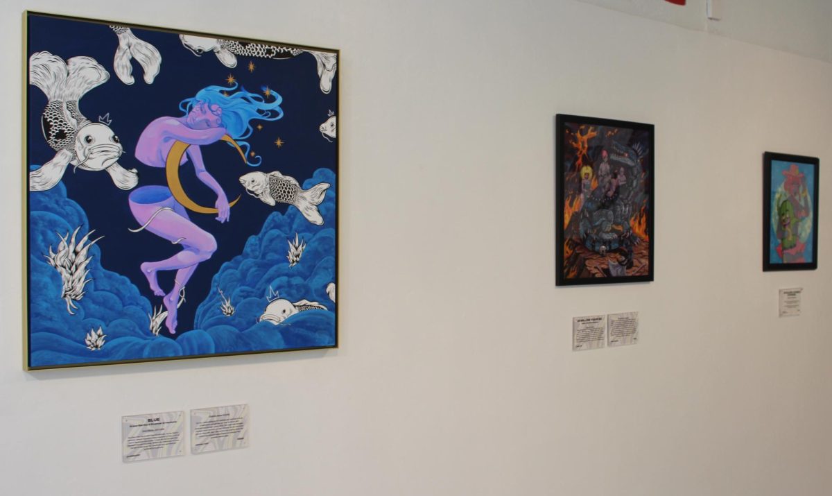 Several works of art are on display for the Worlds Collide art exhibit at &gallery on Fourth Ave. on Sept. 10, 2023. The exhibit showcases collaborative local artwork.