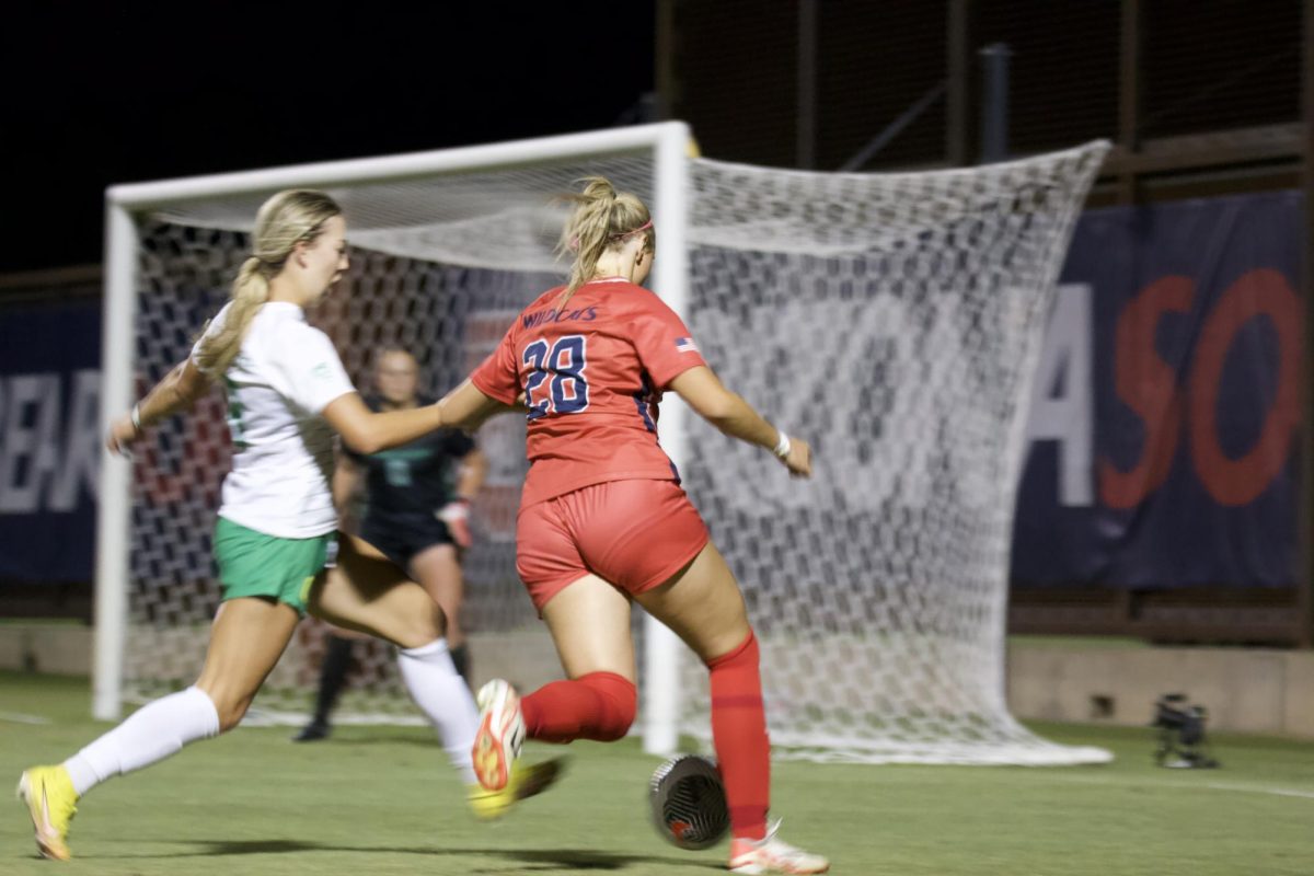 Savannah Holley (28) fights through Oregons defense on Friday, Sept. 22, 2023 at Murphey Field. The Wildcats defeated the Ducks 3-0.